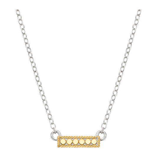 Necklace with a gold bar pendant on a white background