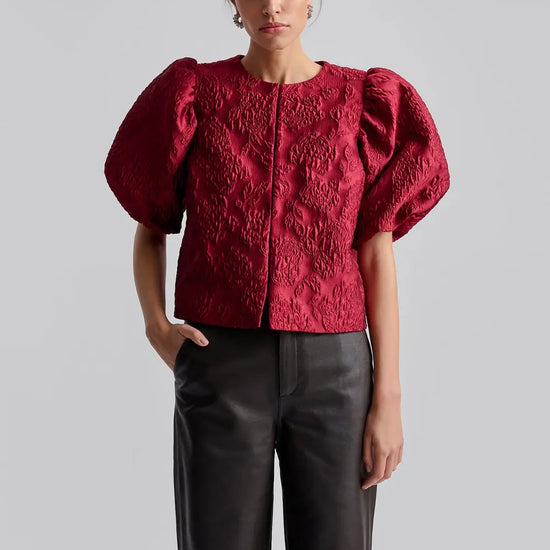 red puff sleeve top with hook eye fastening  model shot 