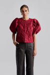 red puff sleeve top with hook eye fastening  model shot 