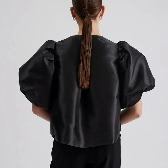 Edge to edge satin jacket in black with puff short sleeves