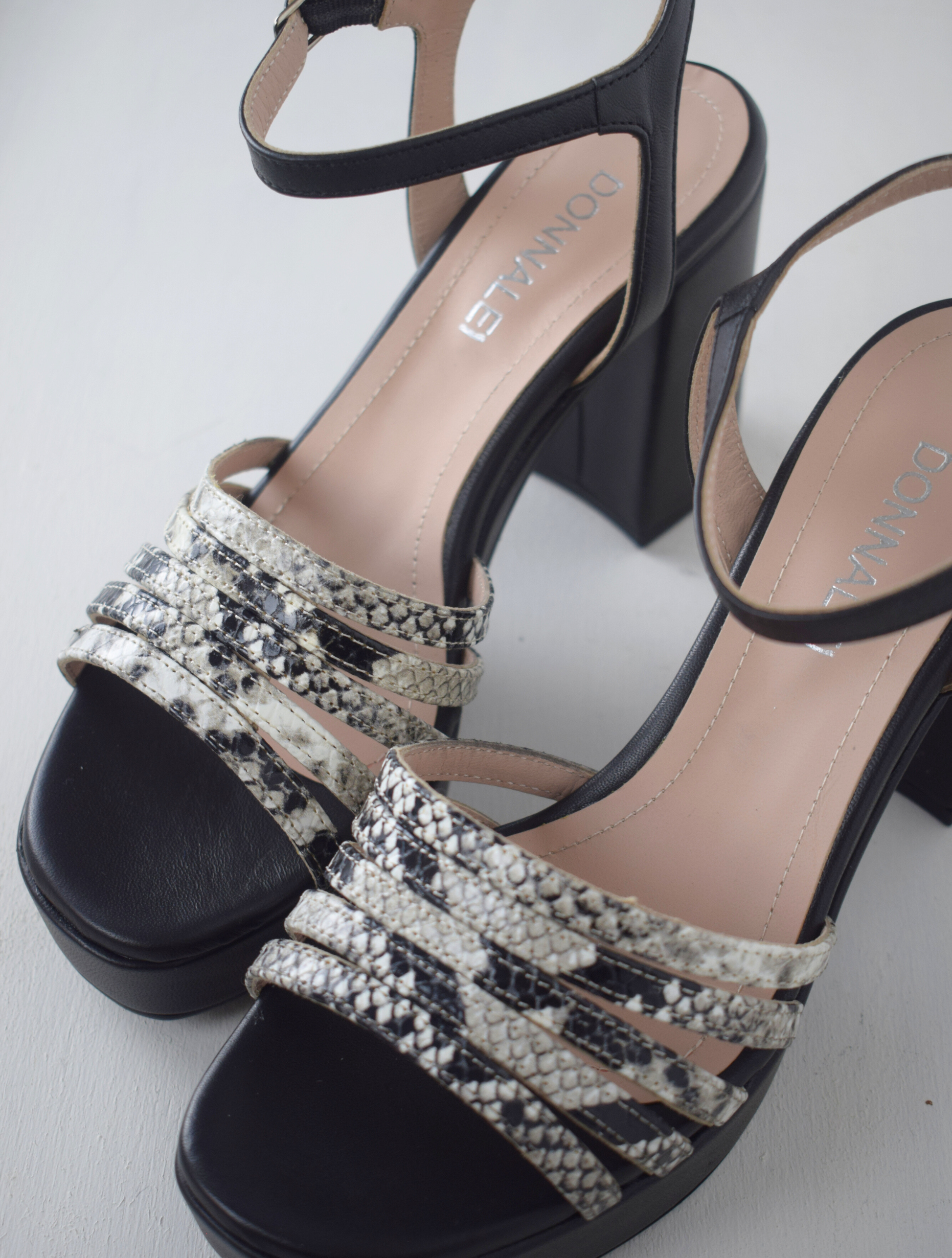 Black platform heel with snake skin straps 