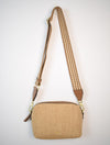 Neutral coloured raffia cross body bag with adjustable strap and leather details