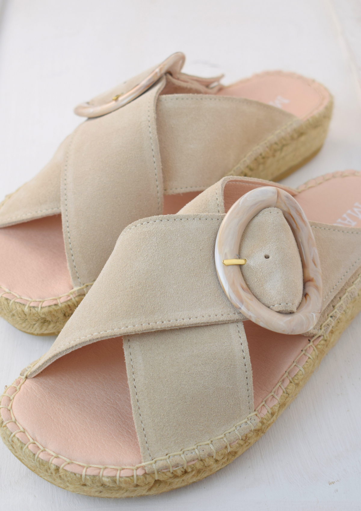 Pale beige slider with buckle detail and raffia sole 