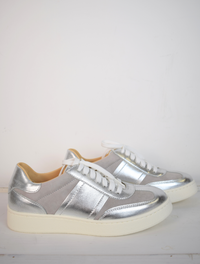 grey trainers with silver detail and white laces 