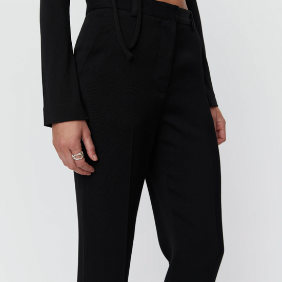 Black tapered tailored flat fronted trousers with side pockets and centre creases