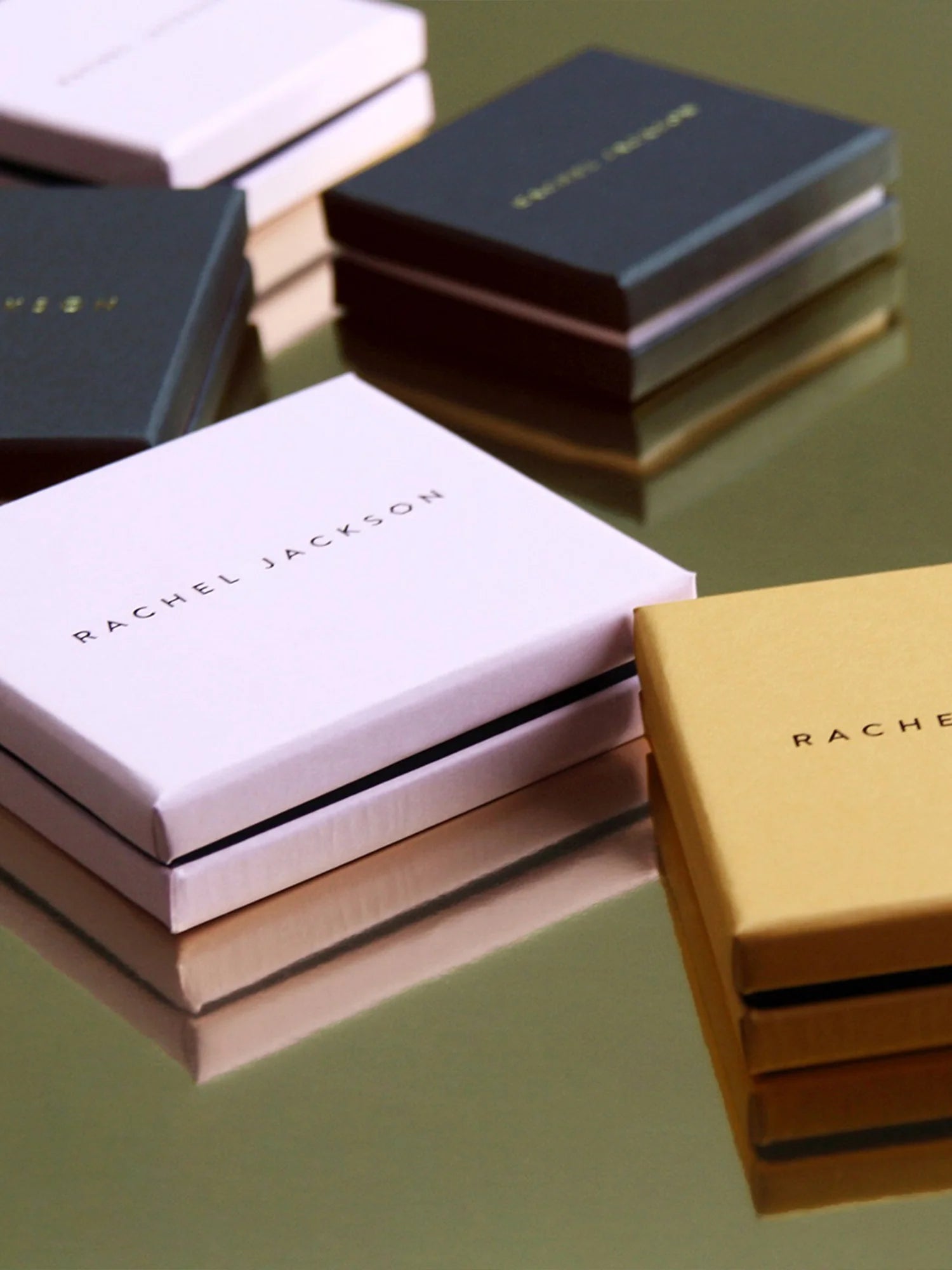 Rachel Jackson boxes on a reflective surface
