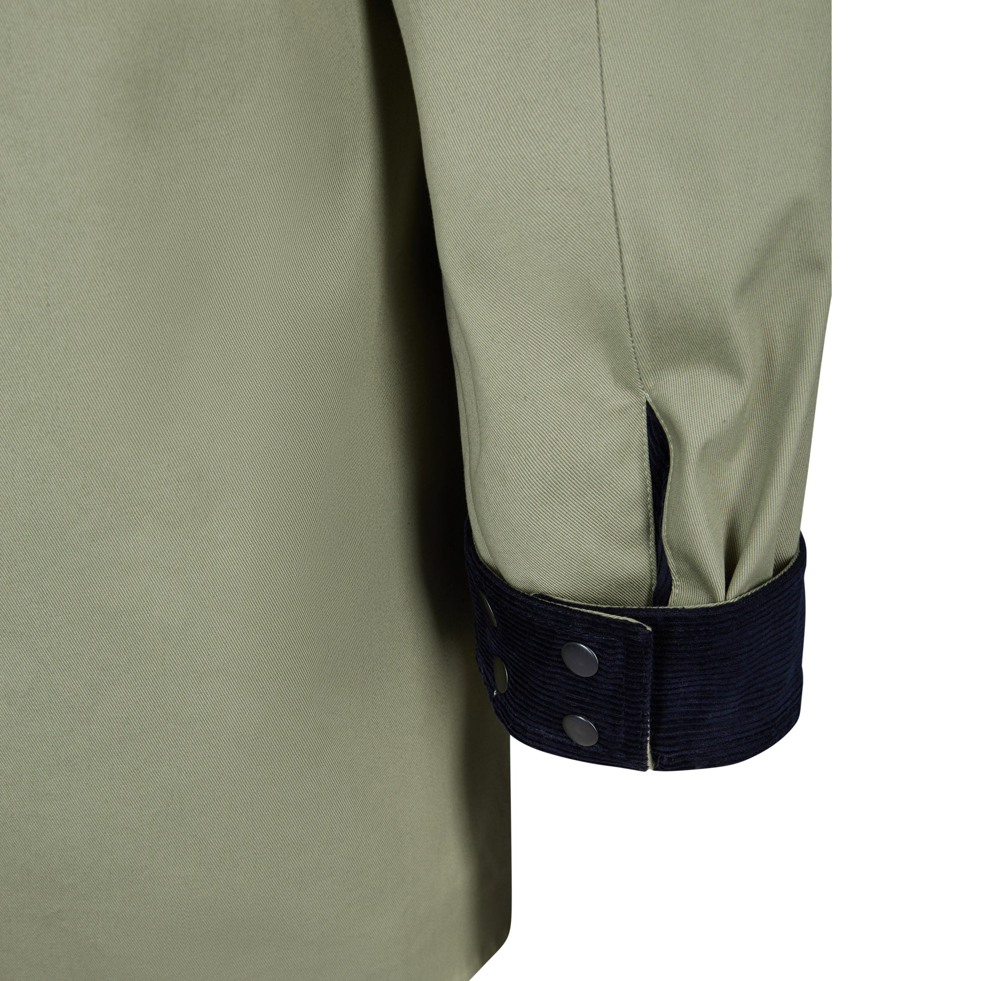 Close up of a jacket cuff turned up with navy cord showing 