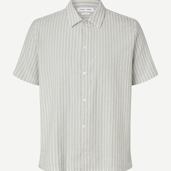 Short-sleeve shirt with a subtle pattern on a white background
