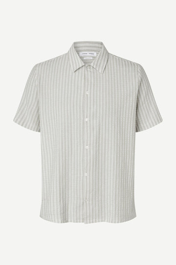 Short-sleeve shirt with a subtle pattern on a white background