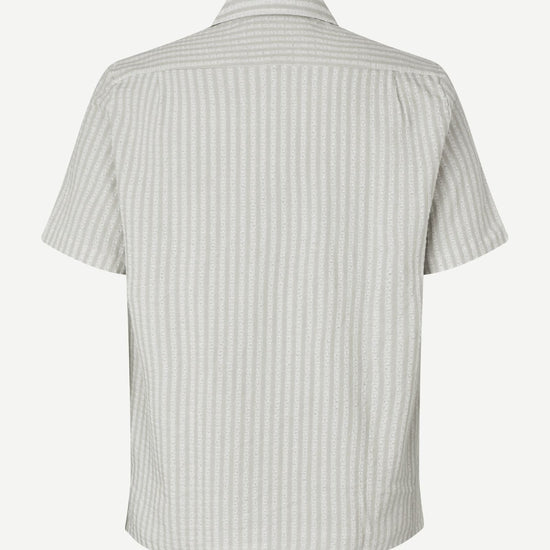 Short-sleeve shirt with a subtle pattern on a white background