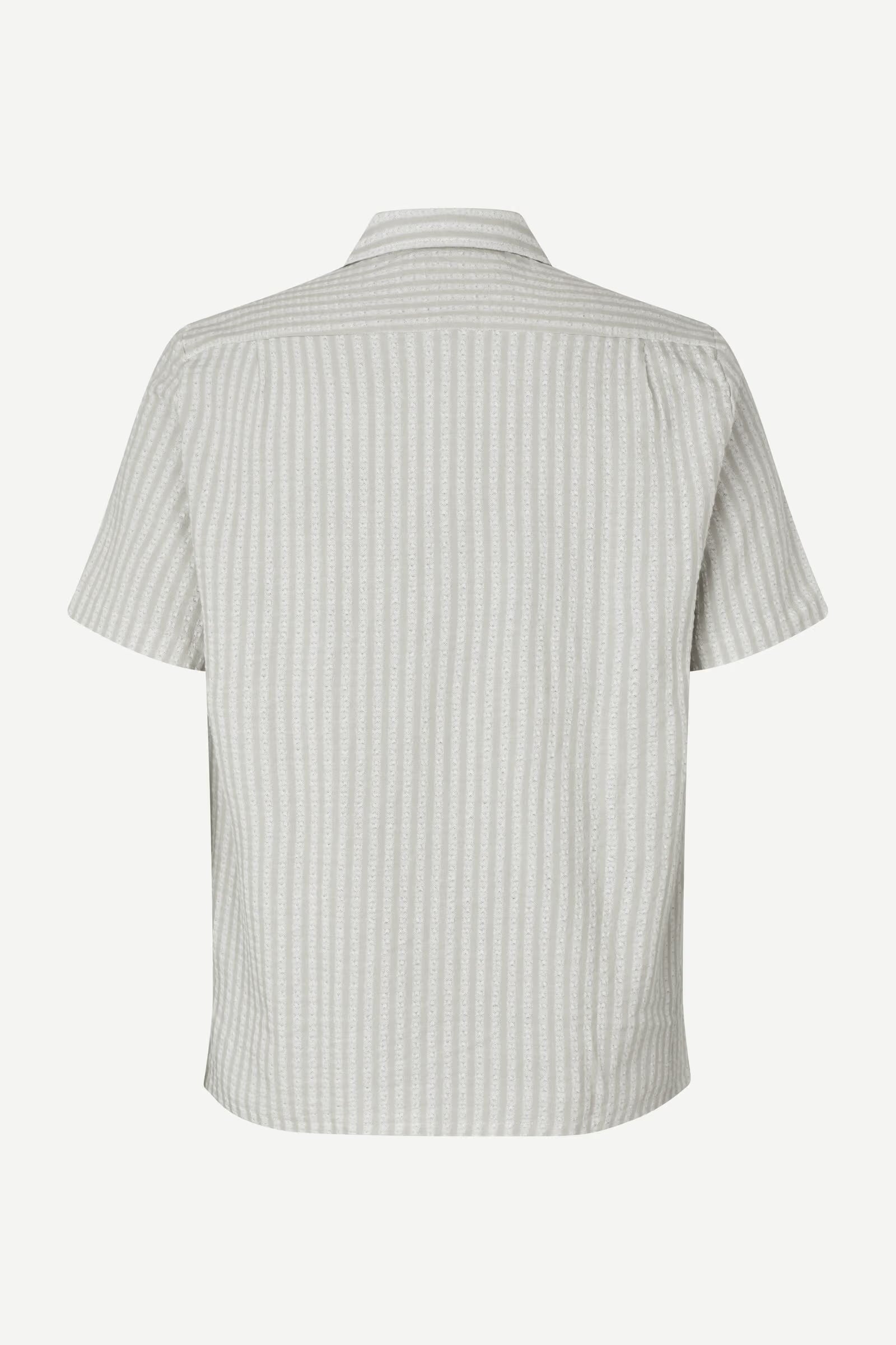 Short-sleeve shirt with a subtle pattern on a white background
