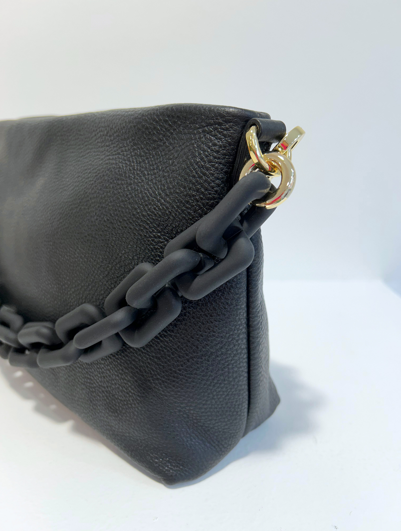 Black shoulder bag with gold hardware and pebbled black leather