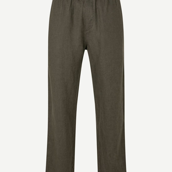 Green linen trousers on a white background from Samsoe Samsoe Menswear