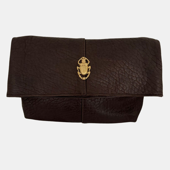 brown lamb leather fold over bag with adjustable strap and gold scarab detail