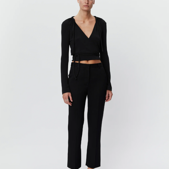 Black tapered tailored flat fronted trousers with side pockets and centre creases