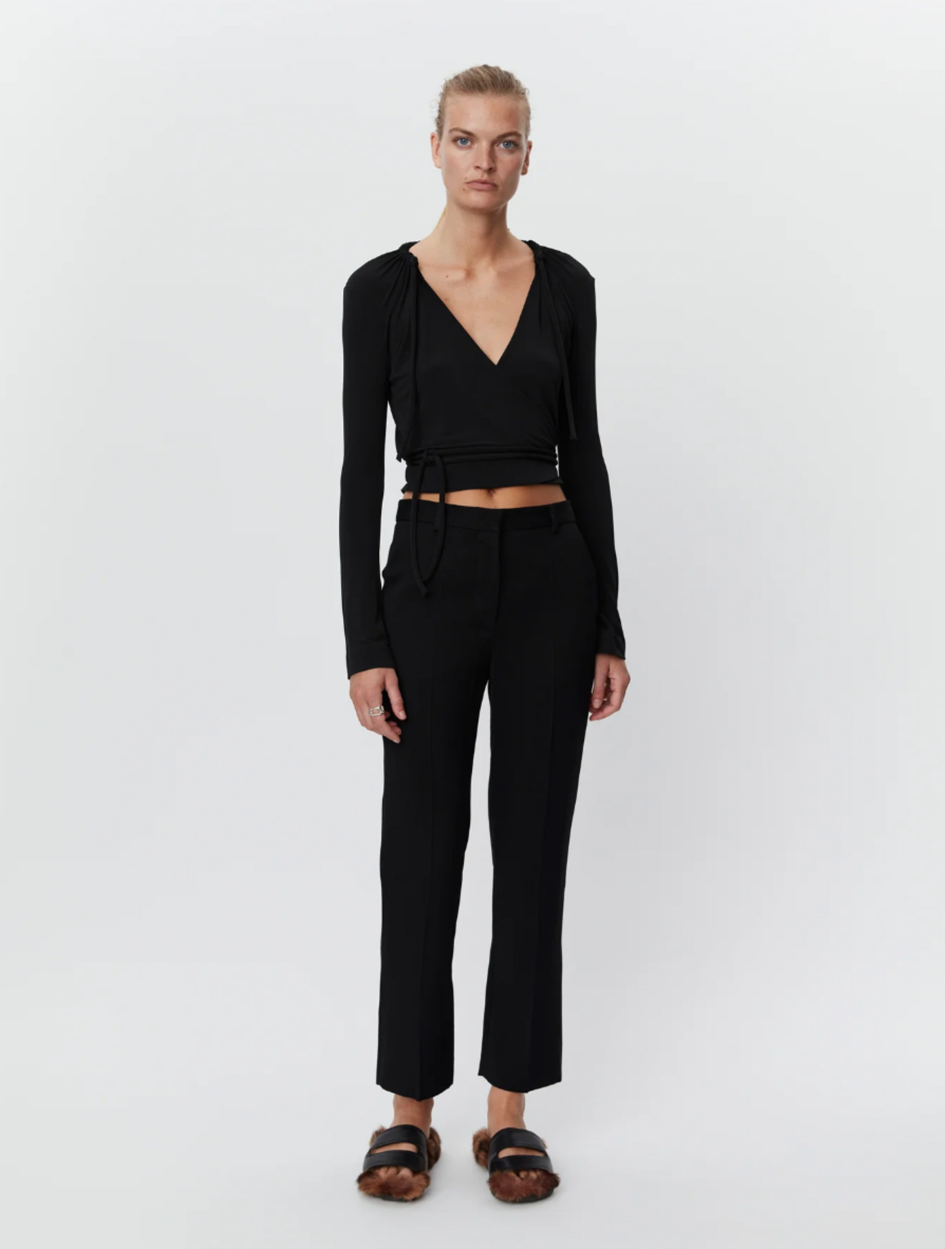 Black tapered tailored flat fronted trousers with side pockets and centre creases