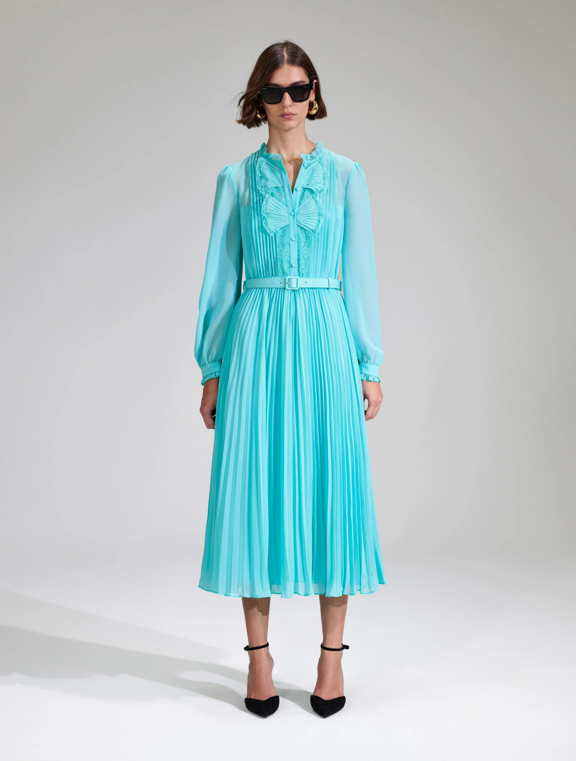 Aqua midi dress with matching fabric belt pleated skirt and long sheer sleeves with fan like details on the placket