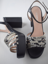 Black platform heel with snake skin straps 