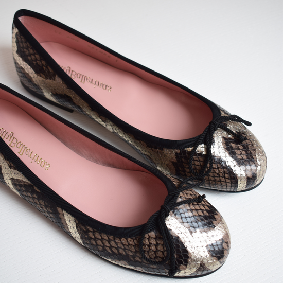 Mock snake leather ballet pumps with black bow on toe with gold shimmer detail