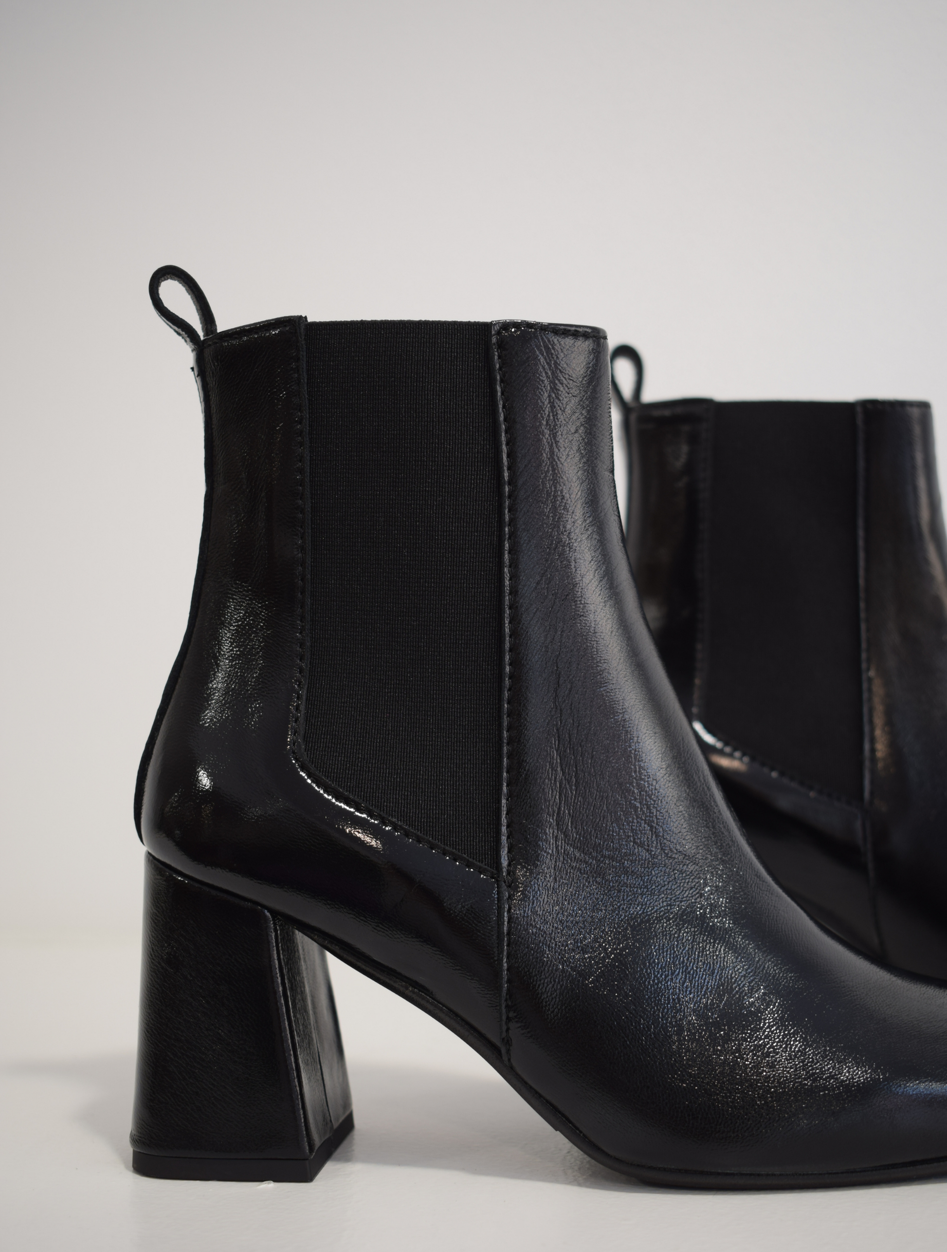 Pull on black patent boot with a block heel