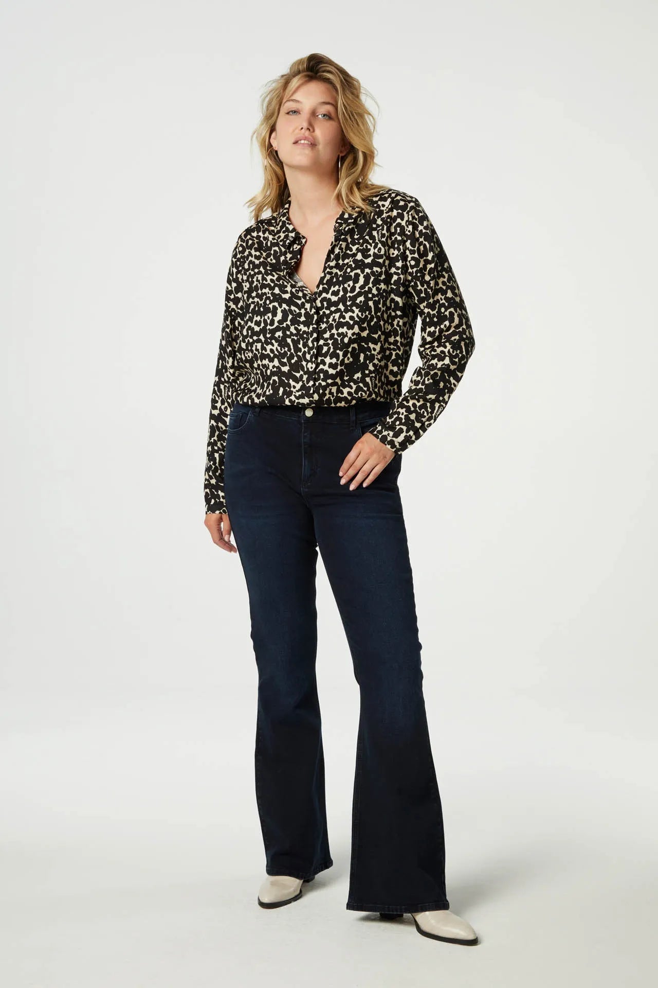 Classic shirt with full length covered placket in a black and ecru animal print