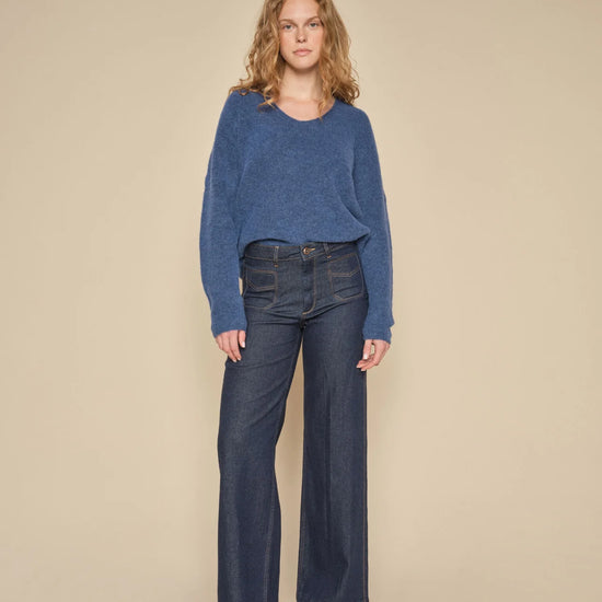 WIde leg dark blue wash jeans with 70's inspired patch pocket design