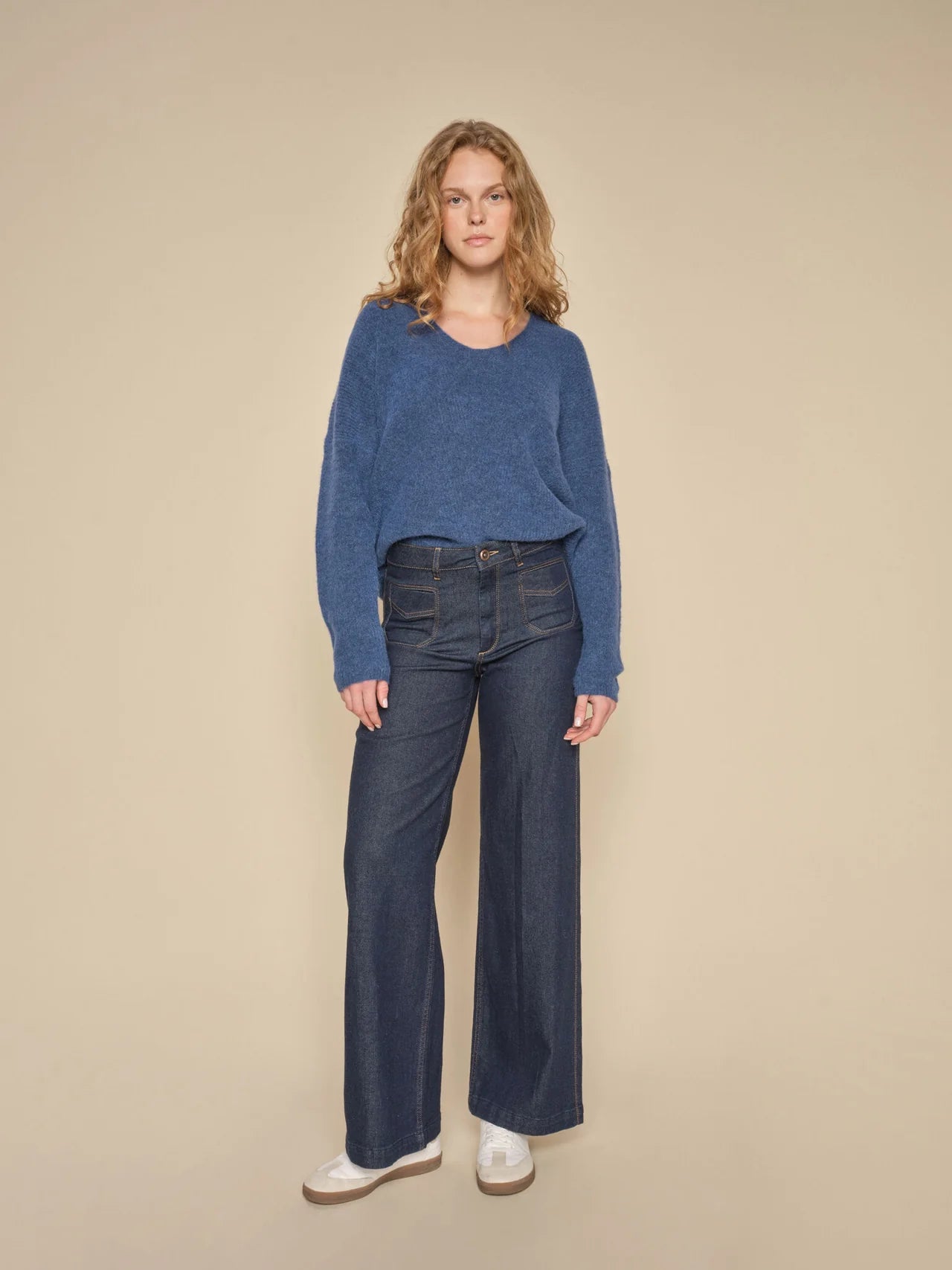 WIde leg dark blue wash jeans with 70's inspired patch pocket design