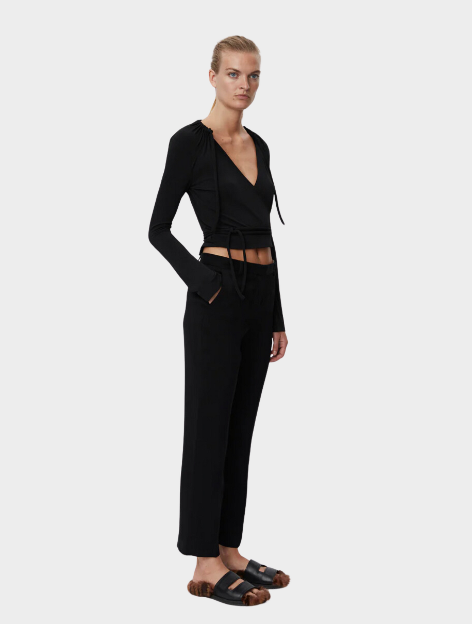 Black tapered tailored flat fronted trousers with side pockets and centre creases