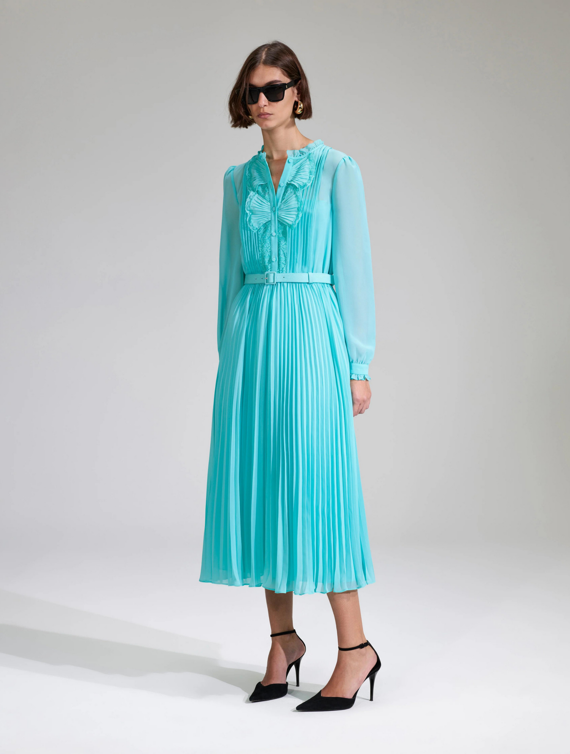 Aqua midi dress with matching fabric belt pleated skirt and long sheer sleeves with fan like details on the placket