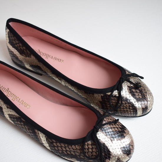 Mock snake leather ballet pumps with black bow on toe with gold shimmer detail