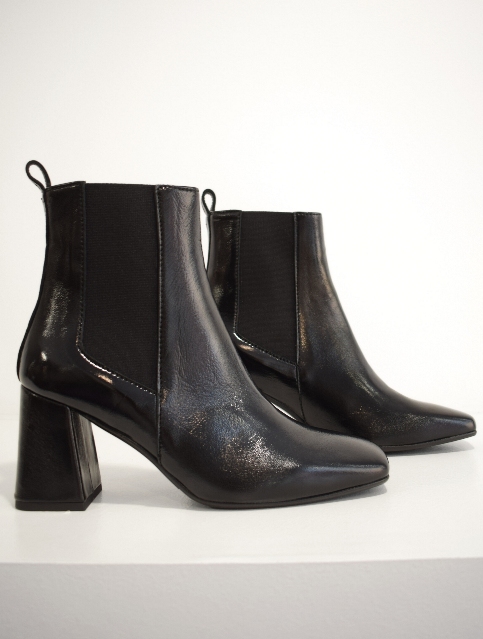 Pull on black patent boot with a block heel