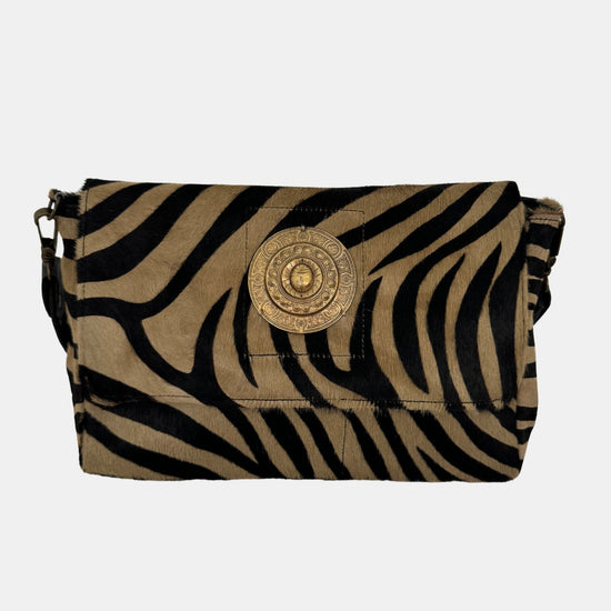 zebra fold over bag with gold emblum and rivet strap