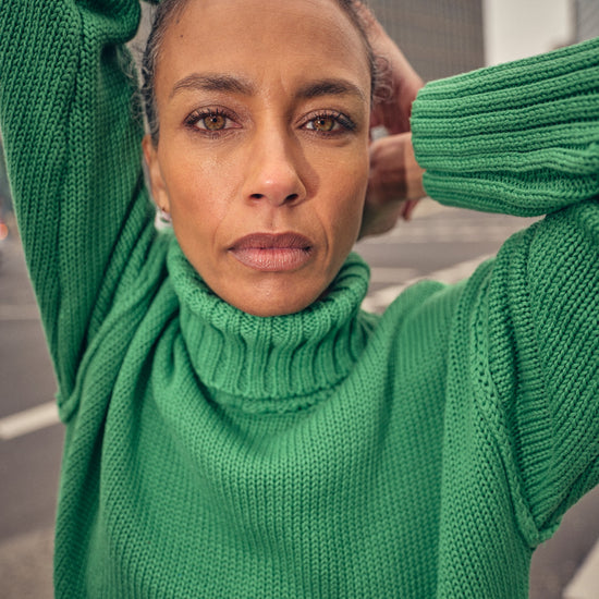 green knitted cotton rollneck with deep ribbed hem, cuffs and neck model shot