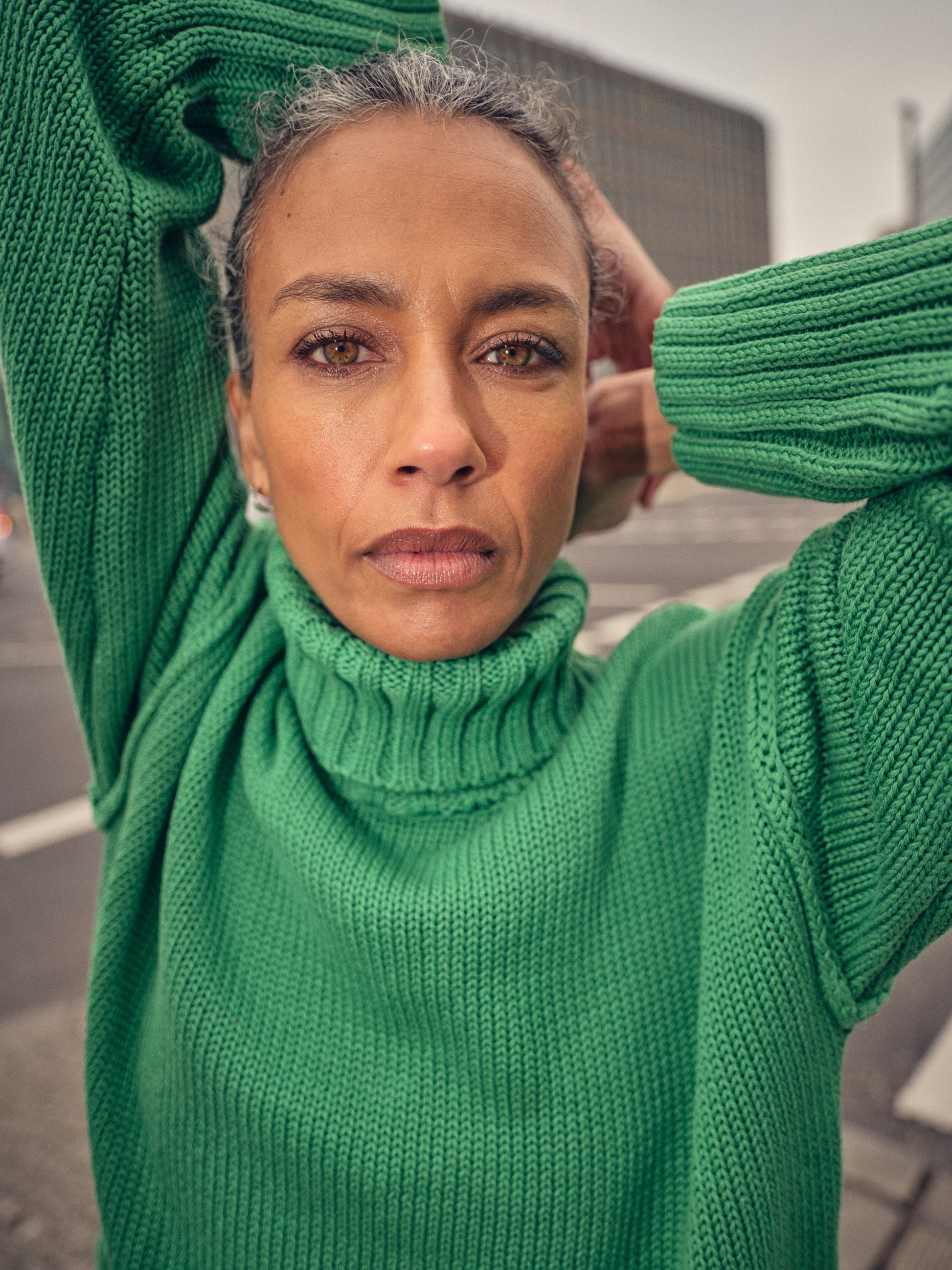 green knitted cotton rollneck with deep ribbed hem, cuffs and neck model shot
