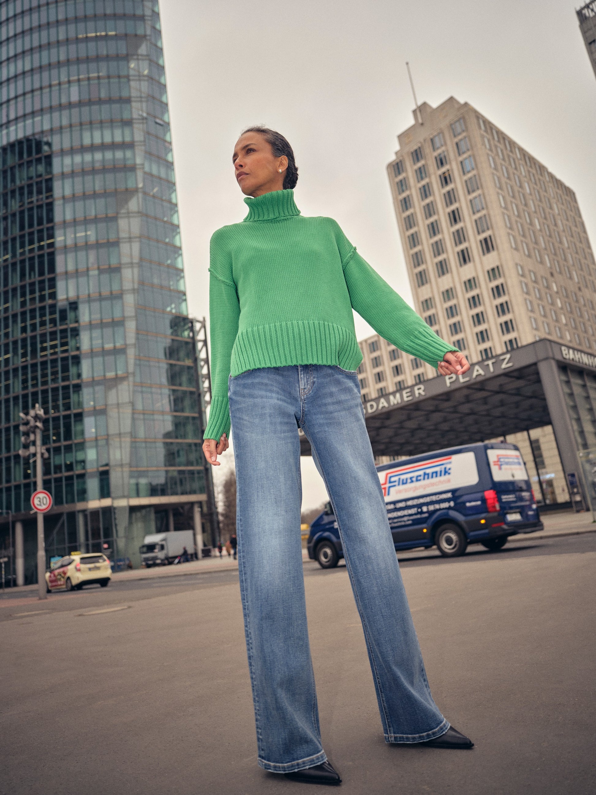 green knitted cotton rollneck with deep ribbed hem, cuffs and neck model shot