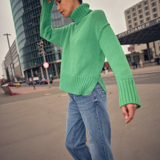  green knitted cotton rollneck with deep ribbed hem, cuffs and neck model shot