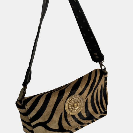 zebra fold over bag with gold emblum and rivet strap