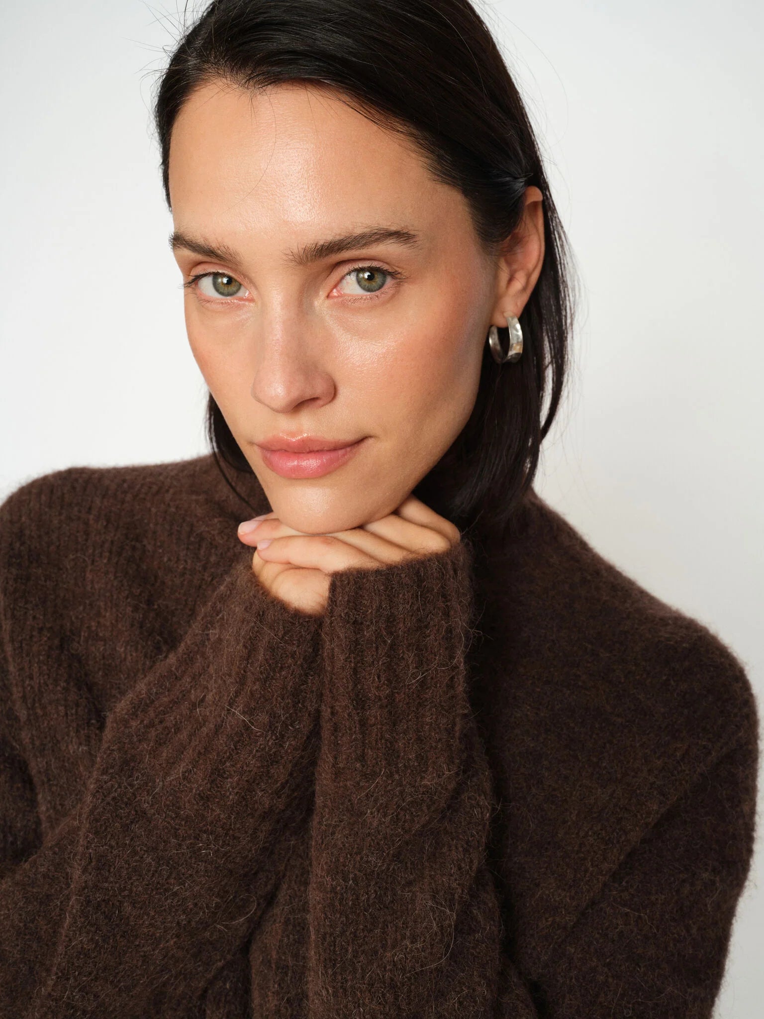 model shot of brown turtle neck knit