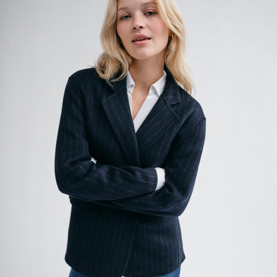 navy wool pinstripe blazer with single breasted, 2 buttons and 2 flap pockets model shot