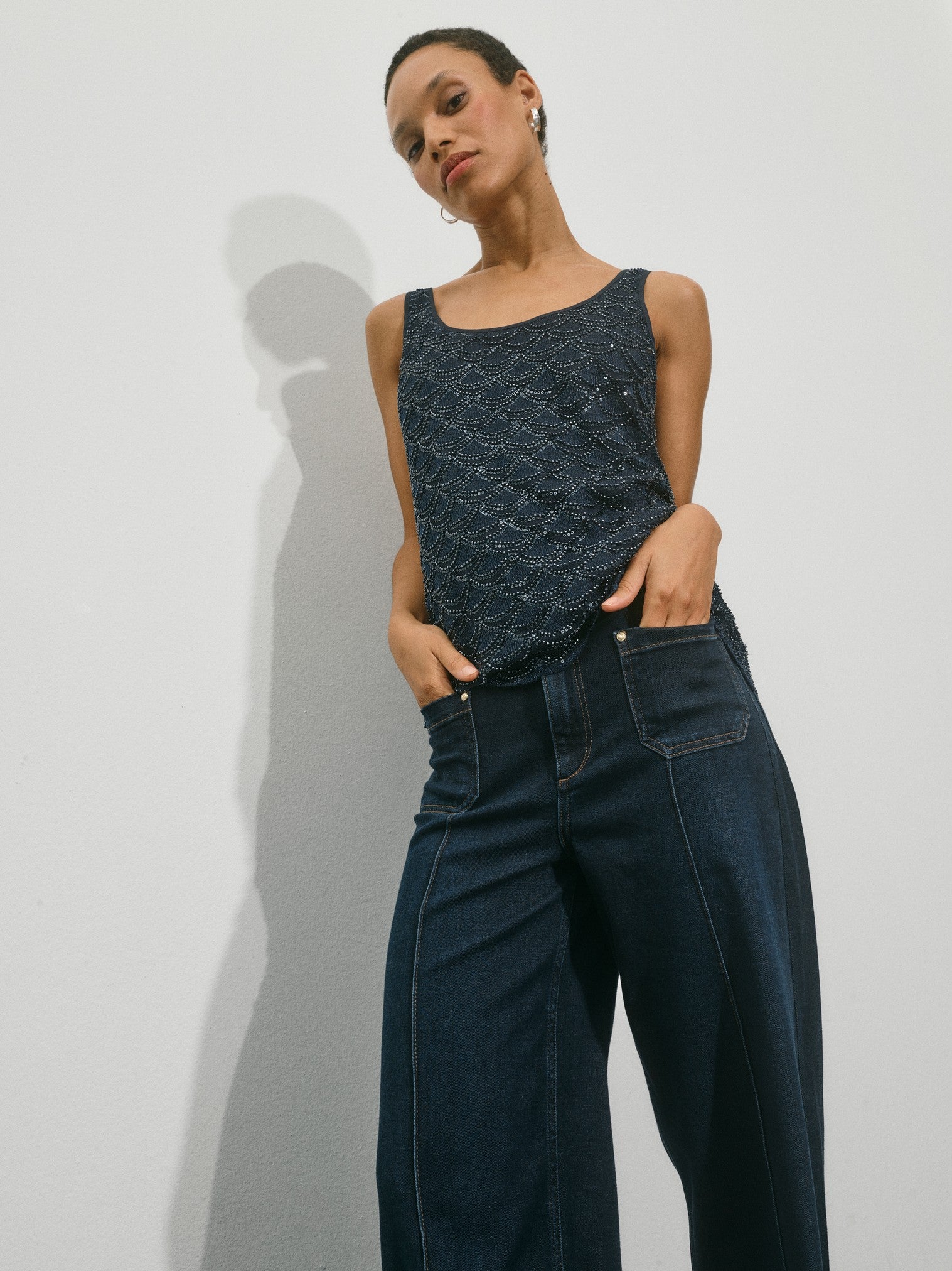 wide leg jeans with front pocket, centre front seam model shot