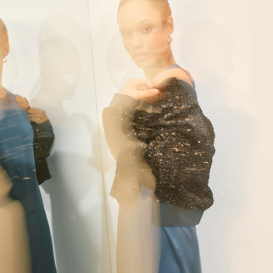 Black bomber jacket with sequins all over and central zip model shot