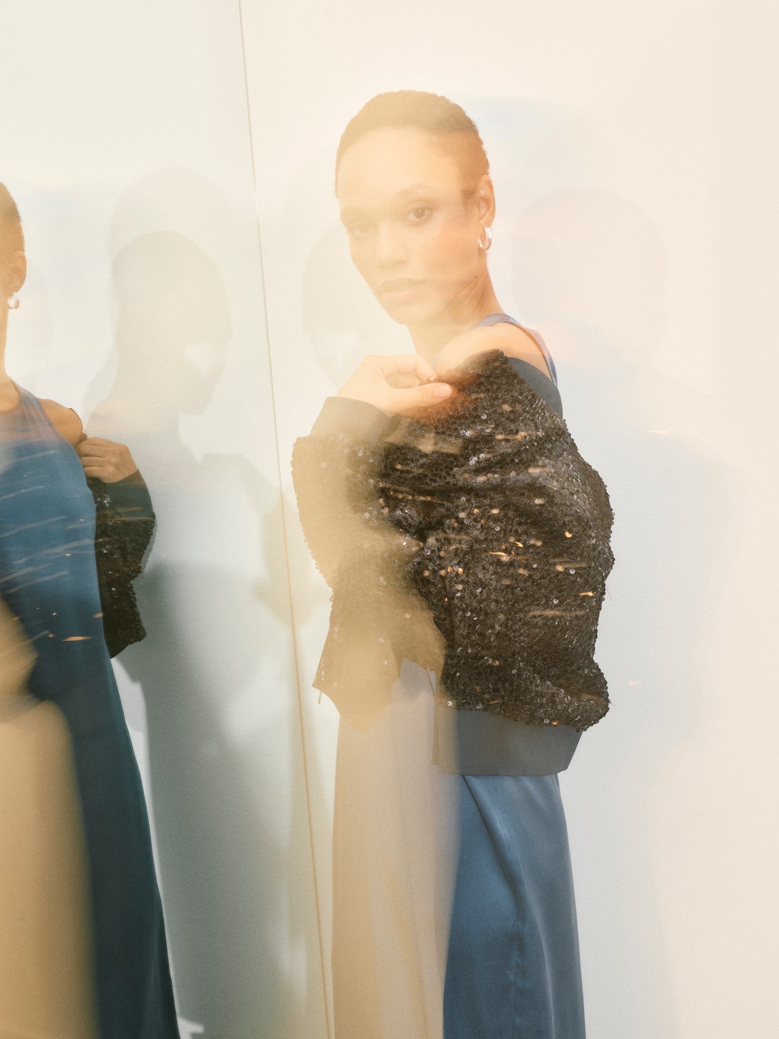 Black bomber jacket with sequins all over and central zip model shot