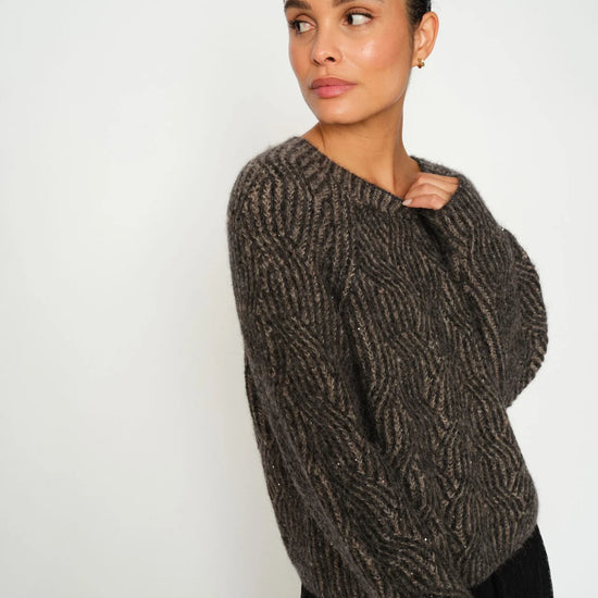 Rib black and brown sequin detailed knit on model with black skirt from mos mosh