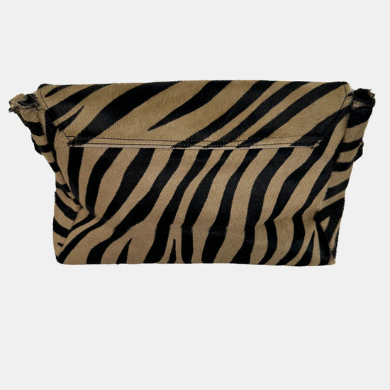 zebra fold over bag with gold emblum and rivet strap rear view