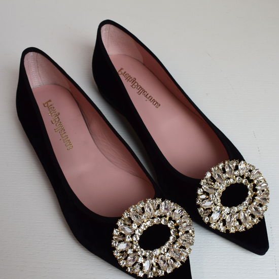 Black velvet pointed toe ballet pumps with gold and diamante brooch on toe