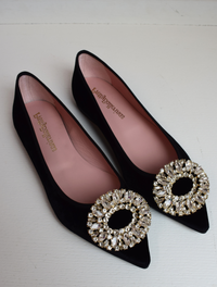 Black velvet pointed toe ballet pumps with gold and diamante brooch on toe