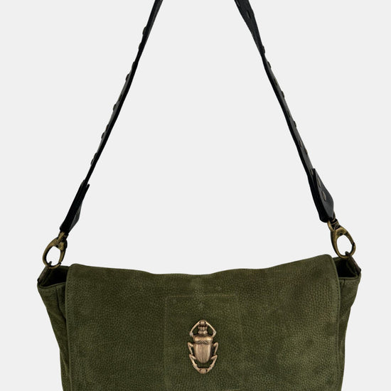 green nubuck leather fold over bag with gold scarab detail and rivet strap