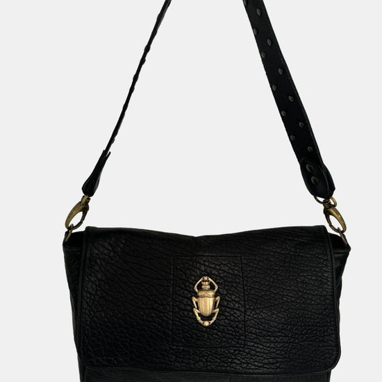 black lamb leather fold over bag with rivet strap and gold scarab emblum