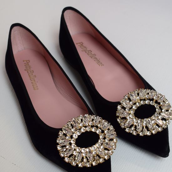 Black velvet pointed toe ballet pumps with gold and diamante brooch on toe