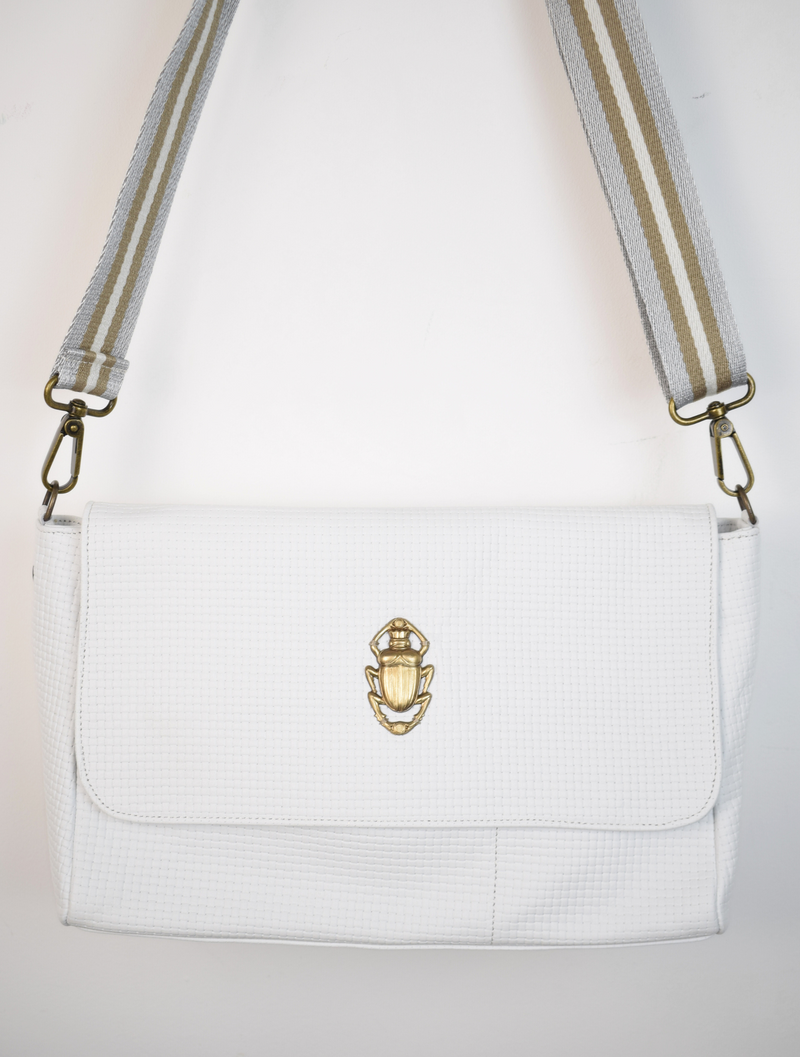 White bag with gold scarab detail